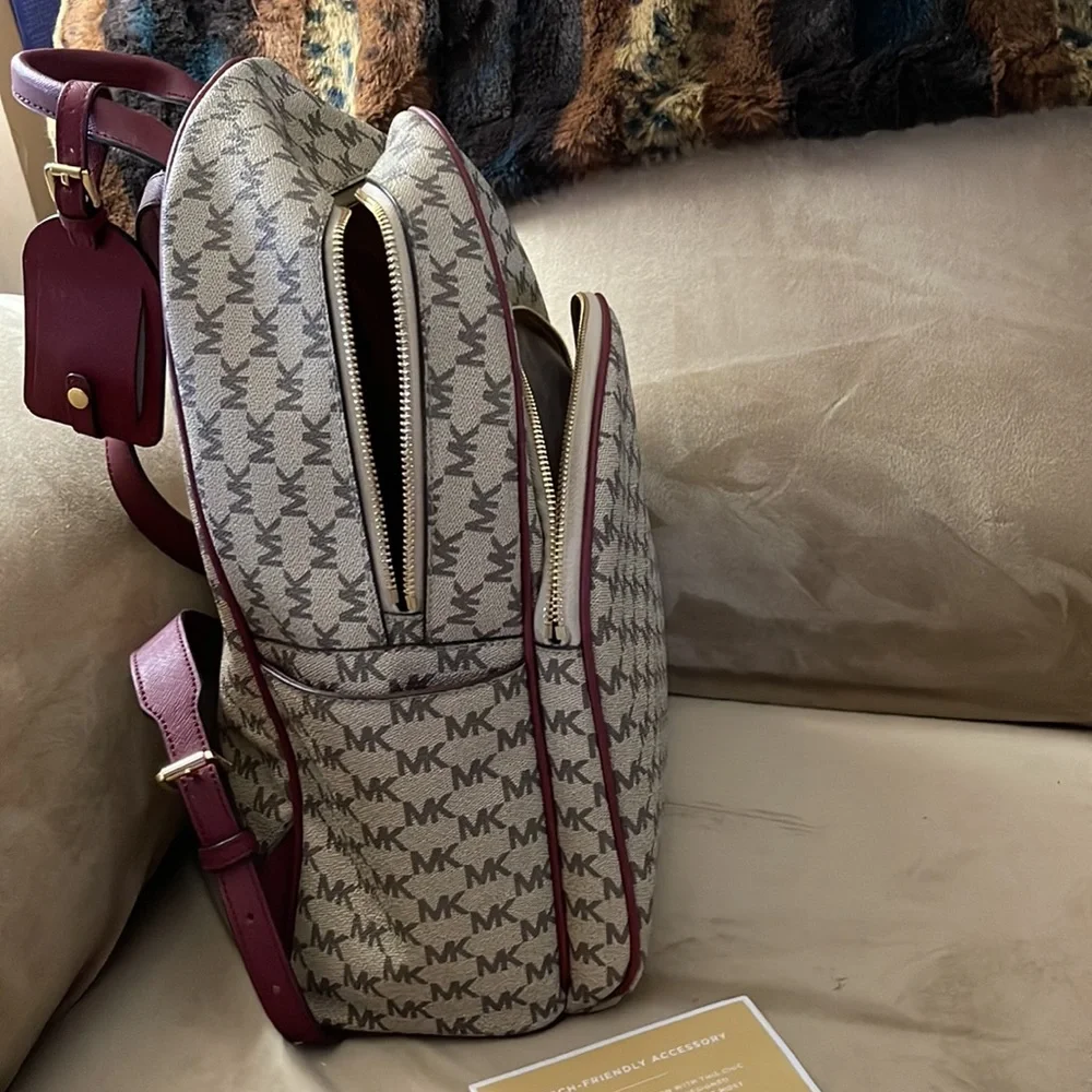 Michael Kors backpack a regular sized. Tan & burgundy with all the zippers. - Picture 5 of 8